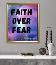 Load image into Gallery viewer, Faith Over Fear inspirational wall art print by Andromeda Cook featuring bold black lettering on a colorful cosmic background framed in gold.

