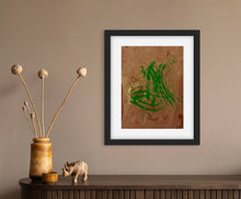 Load image into Gallery viewer, Framed Tracks of Imagination print by Lamonte with green abstract movement on brown background in modern home setting
